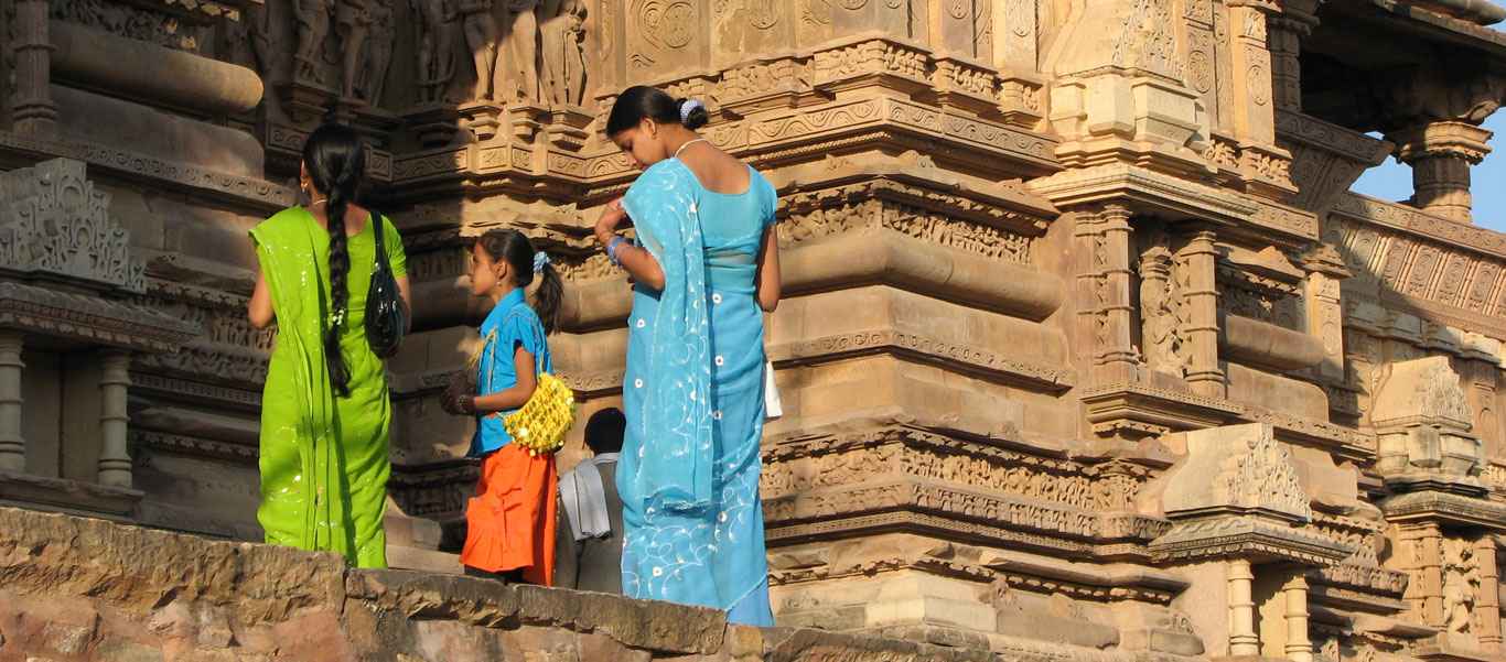 India and Nepal wildlife safari slide of sari dress and sandstone sculptures at Khajuraho temple