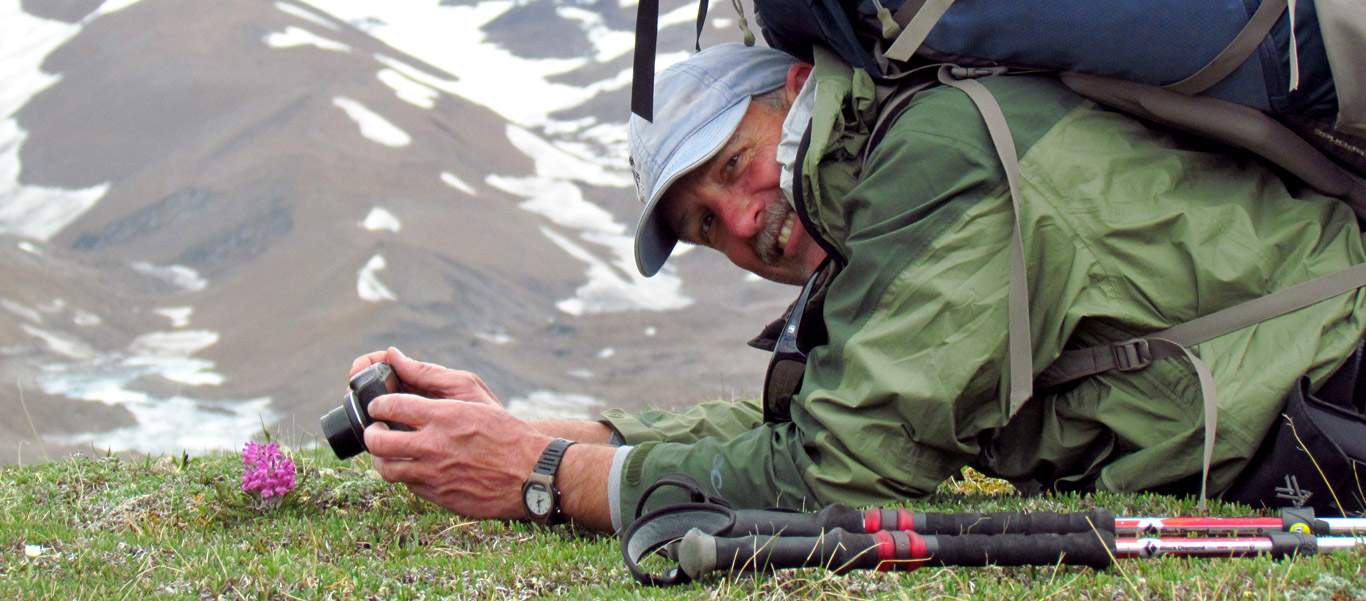 Adventure tours slide of Apex Expeditions leader Kevin Clement taking a photo