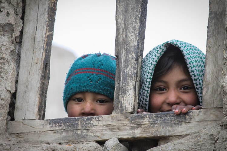 India Snow Leopard Tour slide showing two children in town of Leh
