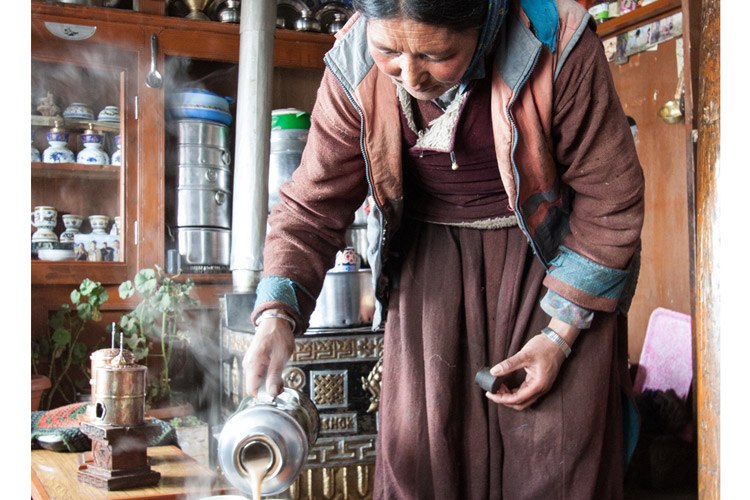 India and Nepal tour photo showing home stay hosts in Rumbak village