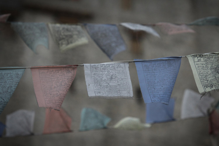 India and Nepal tour slide features prayer flags in Leh