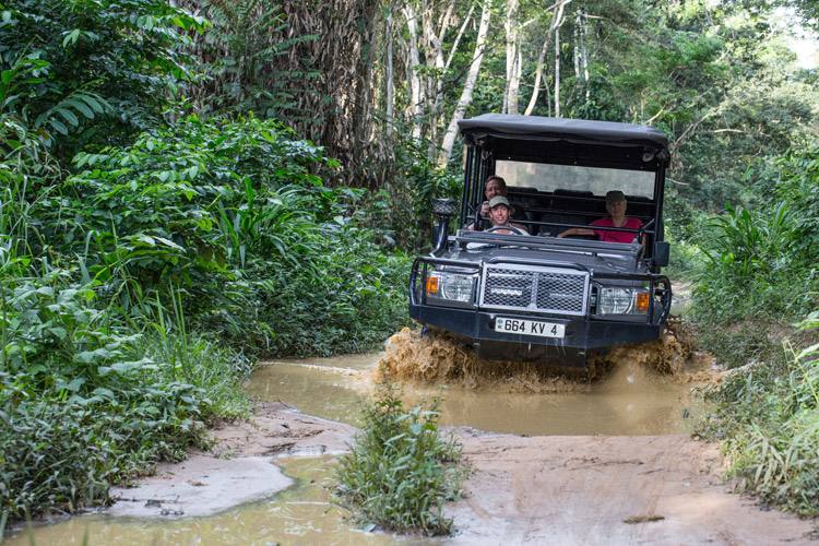 Congo gorilla safari slide shows vehicle driving through Ngaga Camp