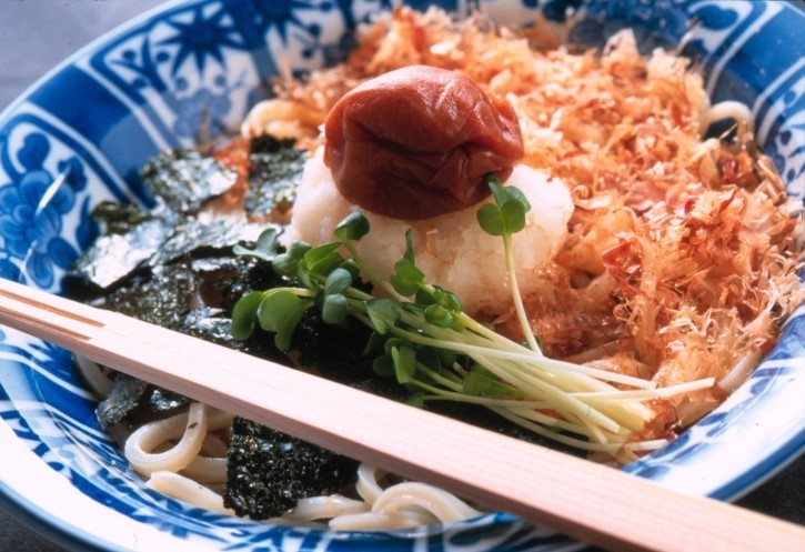 Japan tours slide showing cuisine with chopsticks