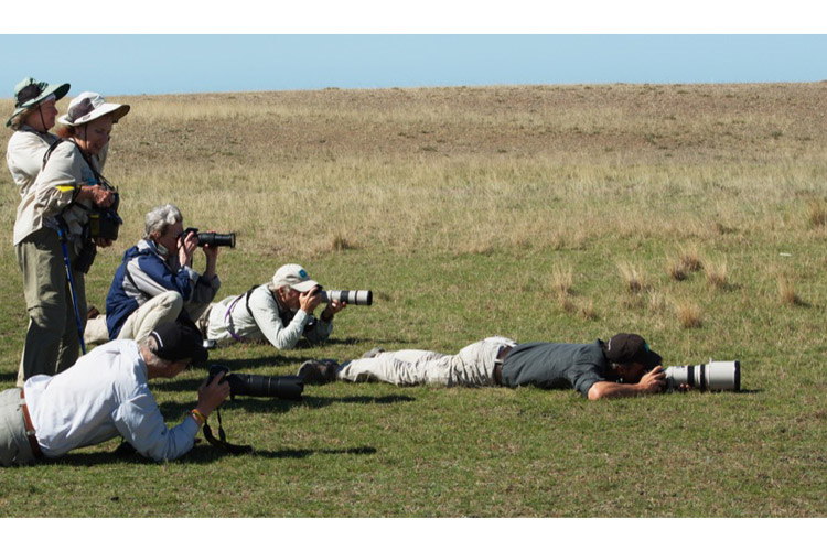 Patagonia adventure expedition slide showing travellers in Punta Delgada photographing a Mara