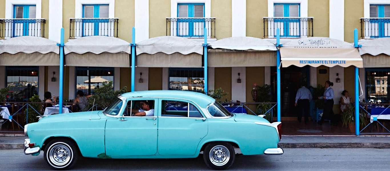 Cuba tours slide showing classic American car in Havana
