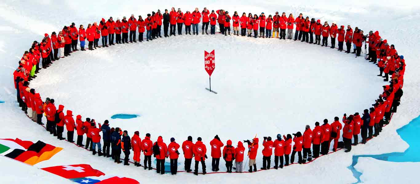 North Pole cruise image of travelers in a circle around the pole.